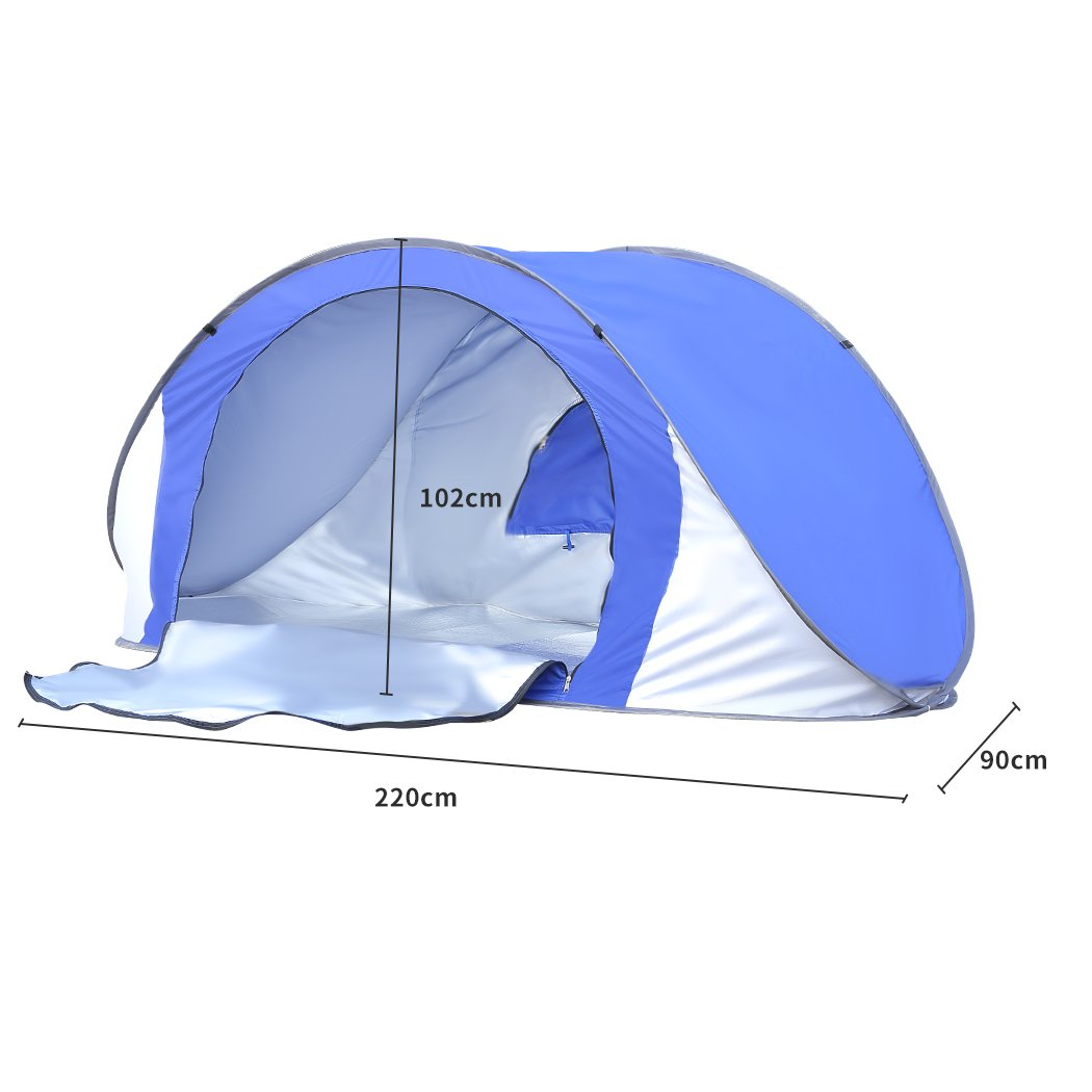 Mountview Pop Up Tent in blue color set up on the beach, showcasing its spacious interior and breathable mesh design.