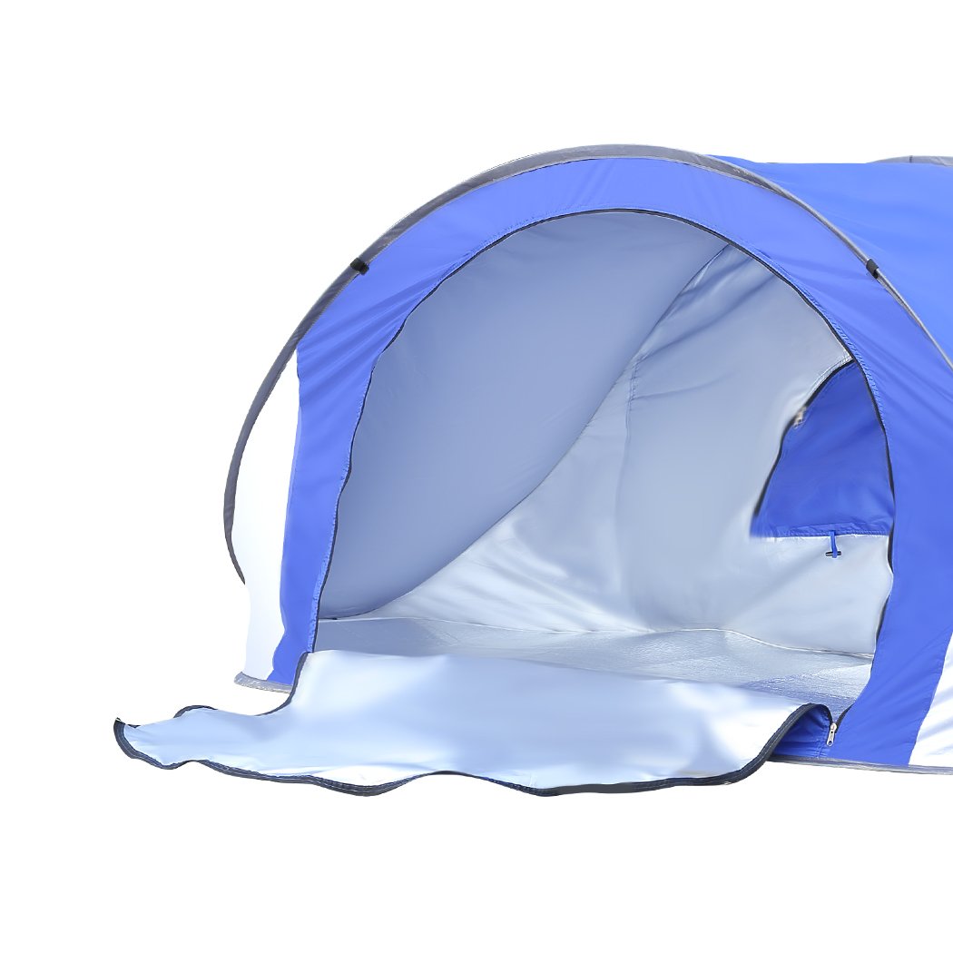 Mountview Pop Up Tent in blue color set up on the beach, showcasing its spacious interior and breathable mesh design.