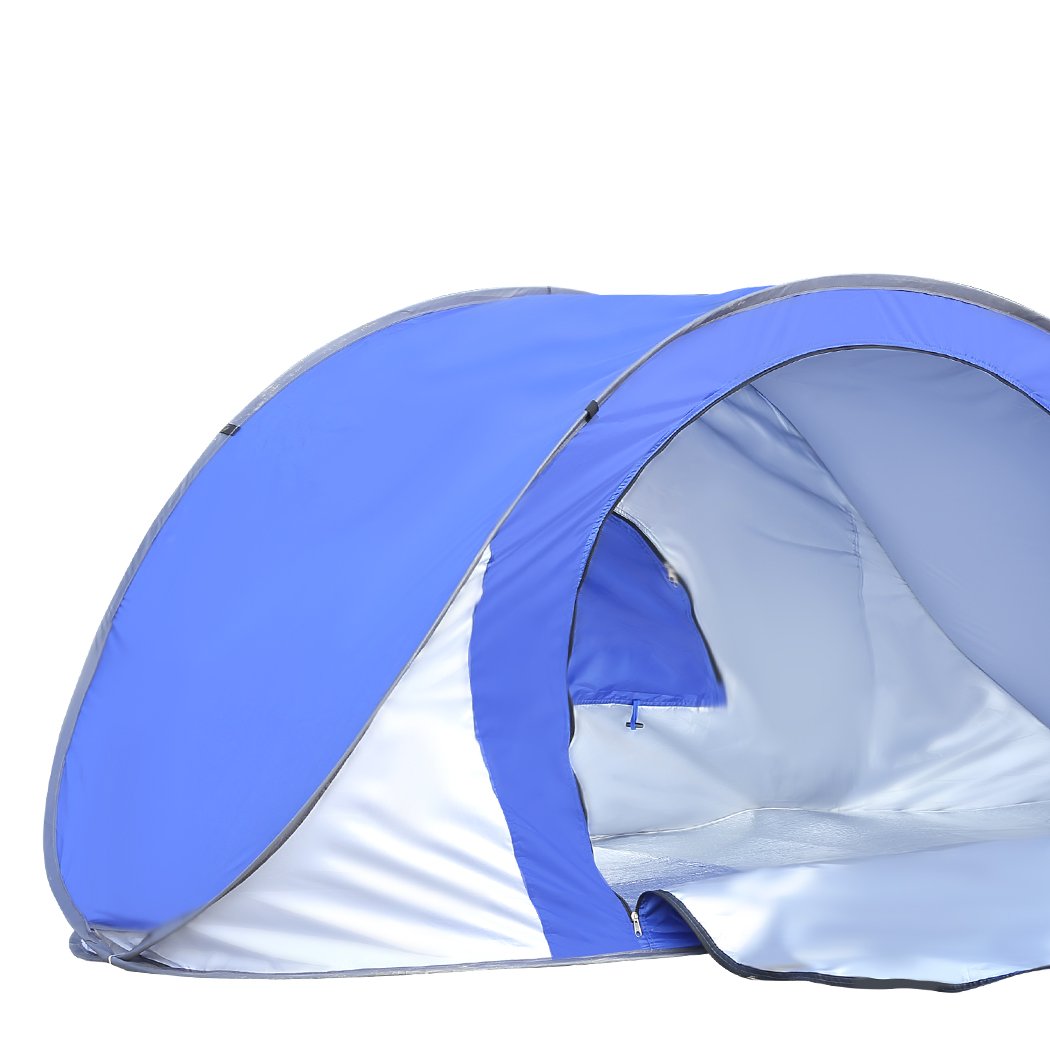 Mountview Pop Up Tent in blue color set up on the beach, showcasing its spacious interior and breathable mesh design.