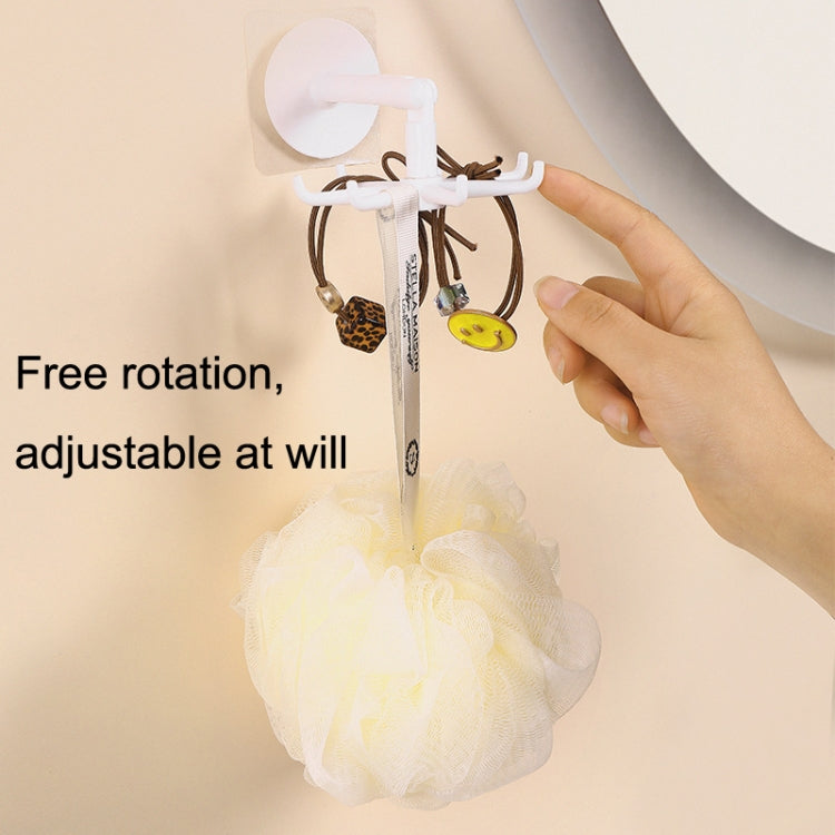 Multifunctional Rotating 7 Claws Hook for kitchen storage, featuring a strong adhesive backing and 360-degree rotation for easy access.