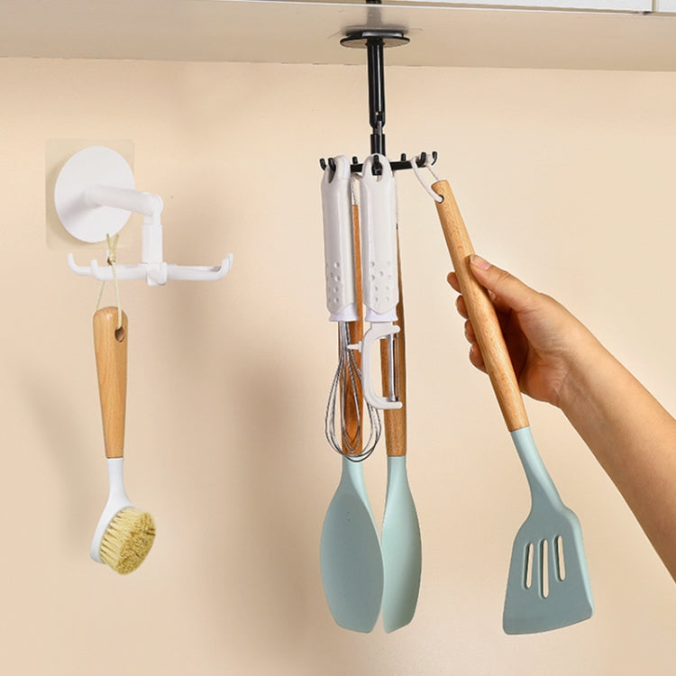 Multifunctional Rotating 7 Claws Hook for kitchen storage, featuring a strong adhesive backing and 360-degree rotation for easy access.