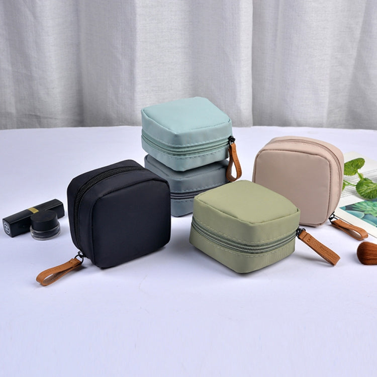 Multifunctional waterproof portable sanitary storage bags in a stylish design, showcasing their compact size and durable nylon material.