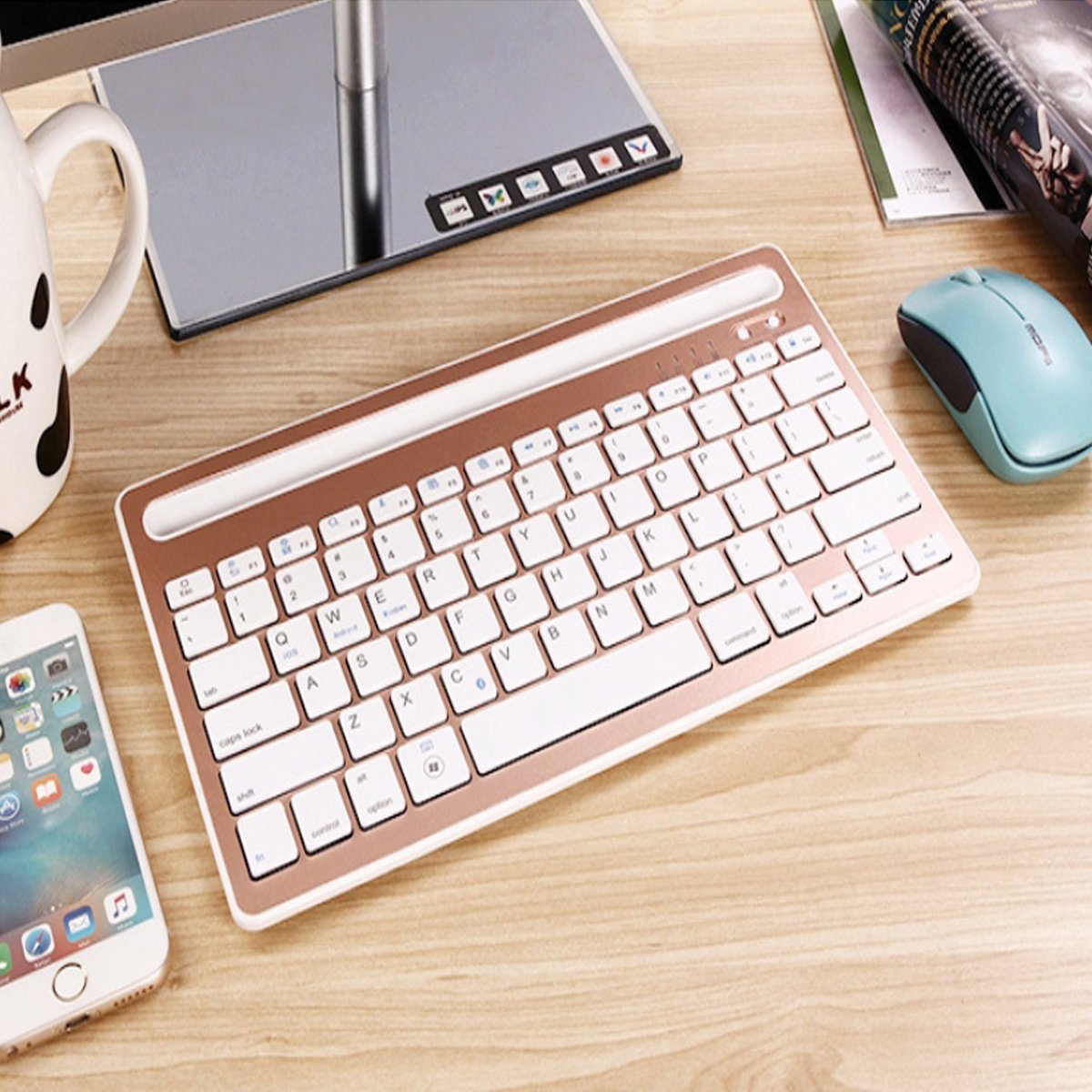 Multi-Task Master Of All Bluetooth Keyboard with built-in stand, showcasing its sleek design and multiple color options.