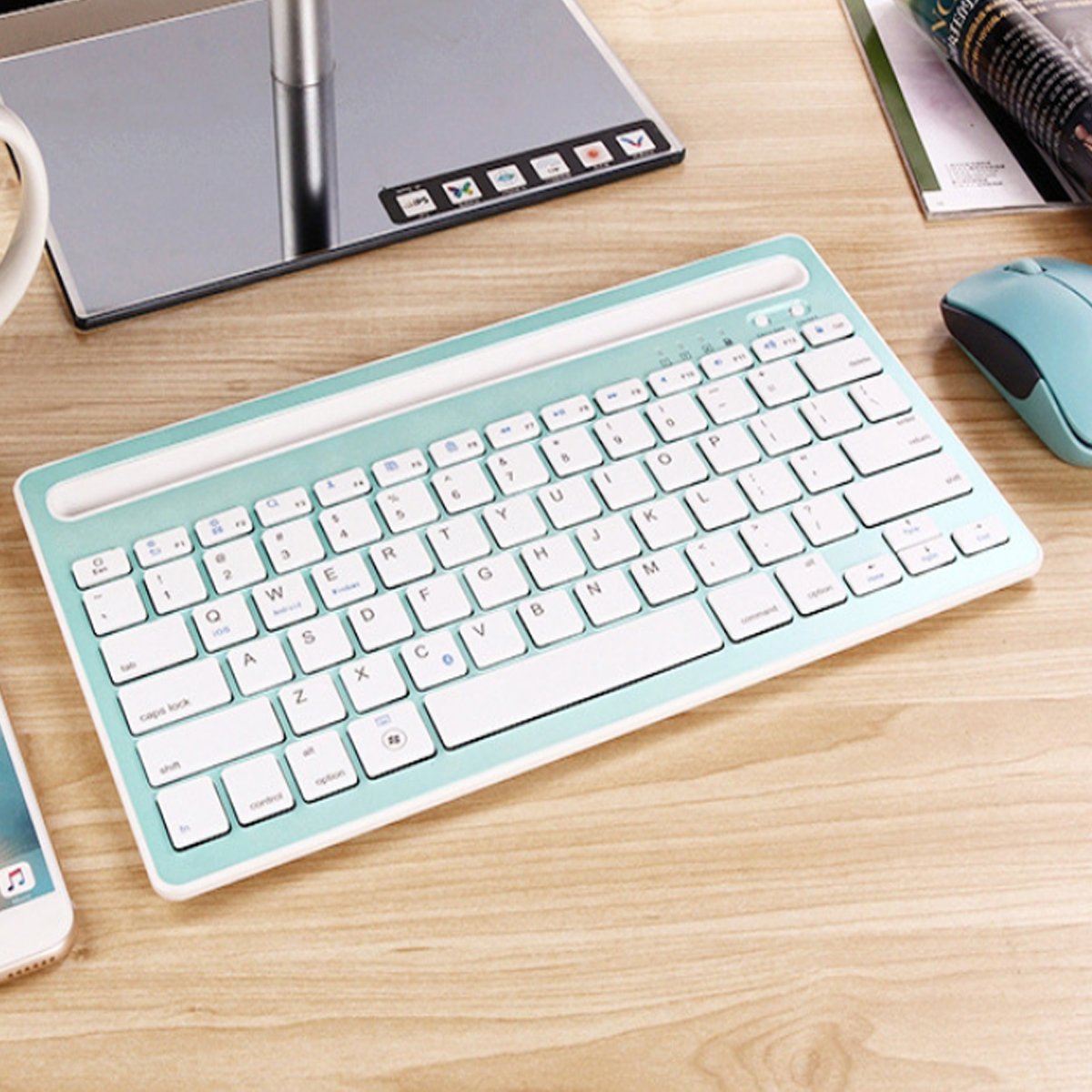 Multi-Task Master Of All Bluetooth Keyboard with built-in stand, showcasing its sleek design and multiple color options.