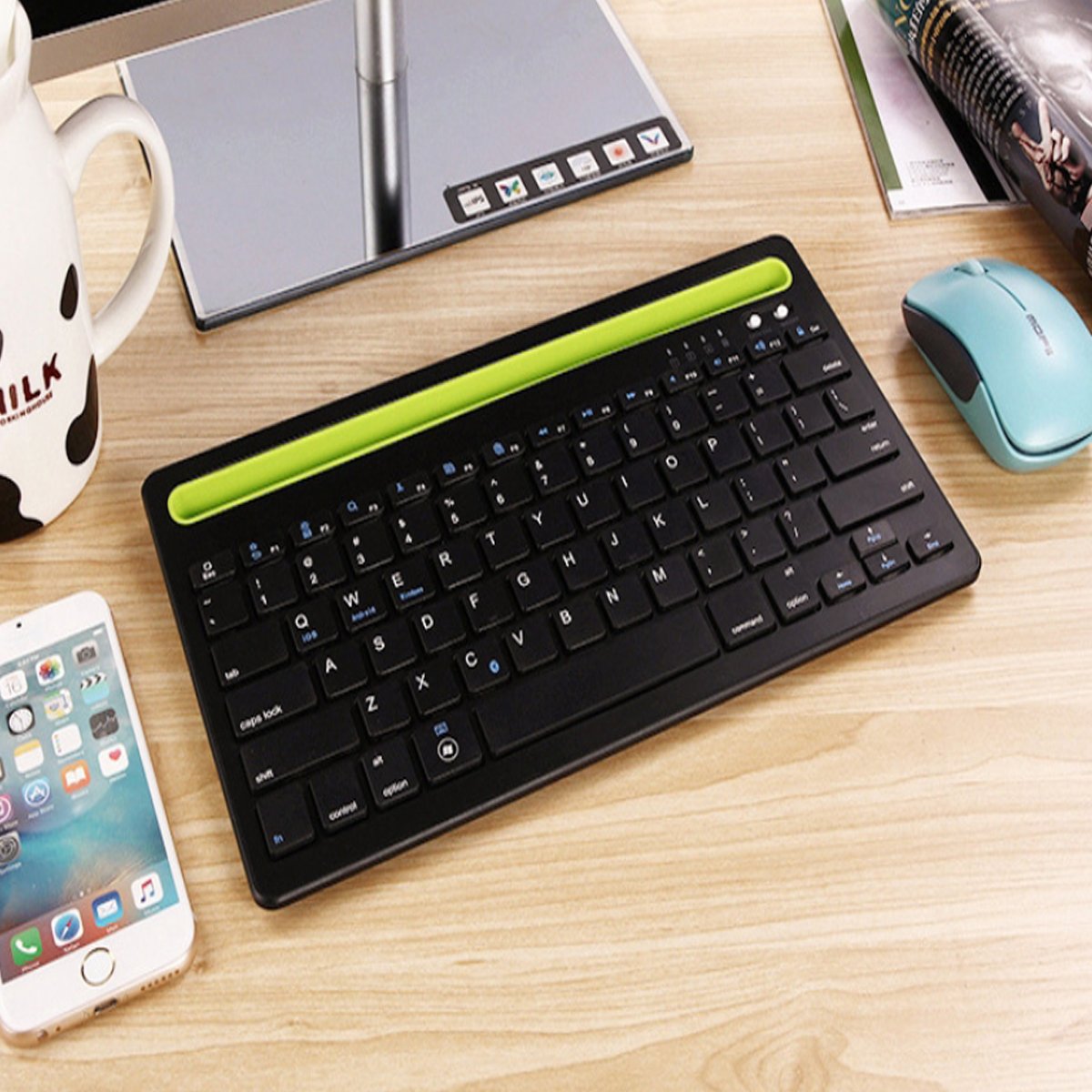 Multi-Task Master Of All Bluetooth Keyboard with built-in stand, showcasing its sleek design and multiple color options.