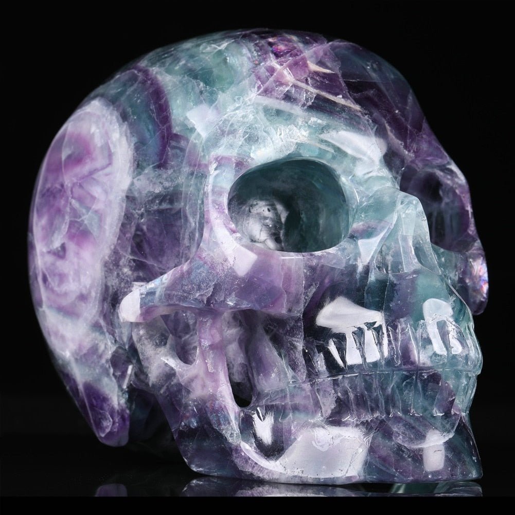 Natural Purple Fluorite 5 Inch Gemstone Skull showcasing vibrant colors and intricate details, symbolizing creativity and emotional healing.