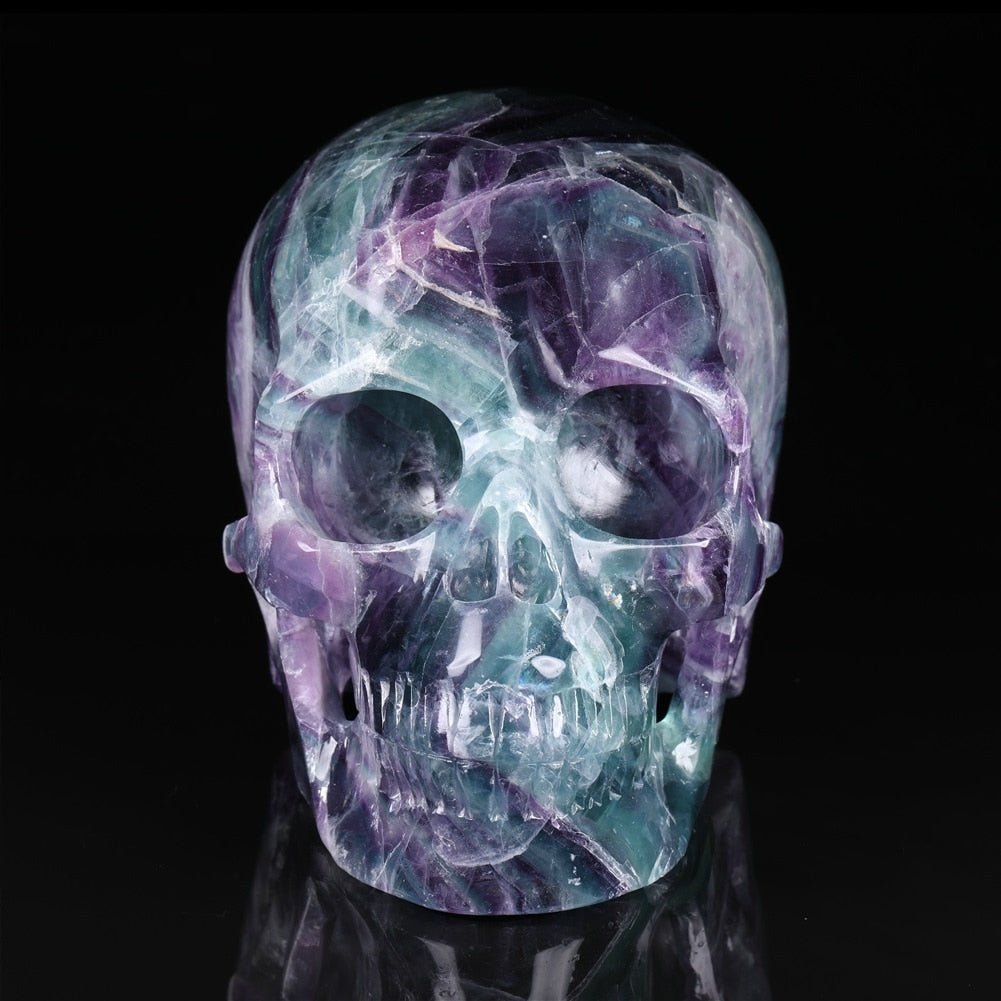 Natural Purple Fluorite 5 Inch Gemstone Skull showcasing vibrant colors and intricate details, symbolizing creativity and emotional healing.