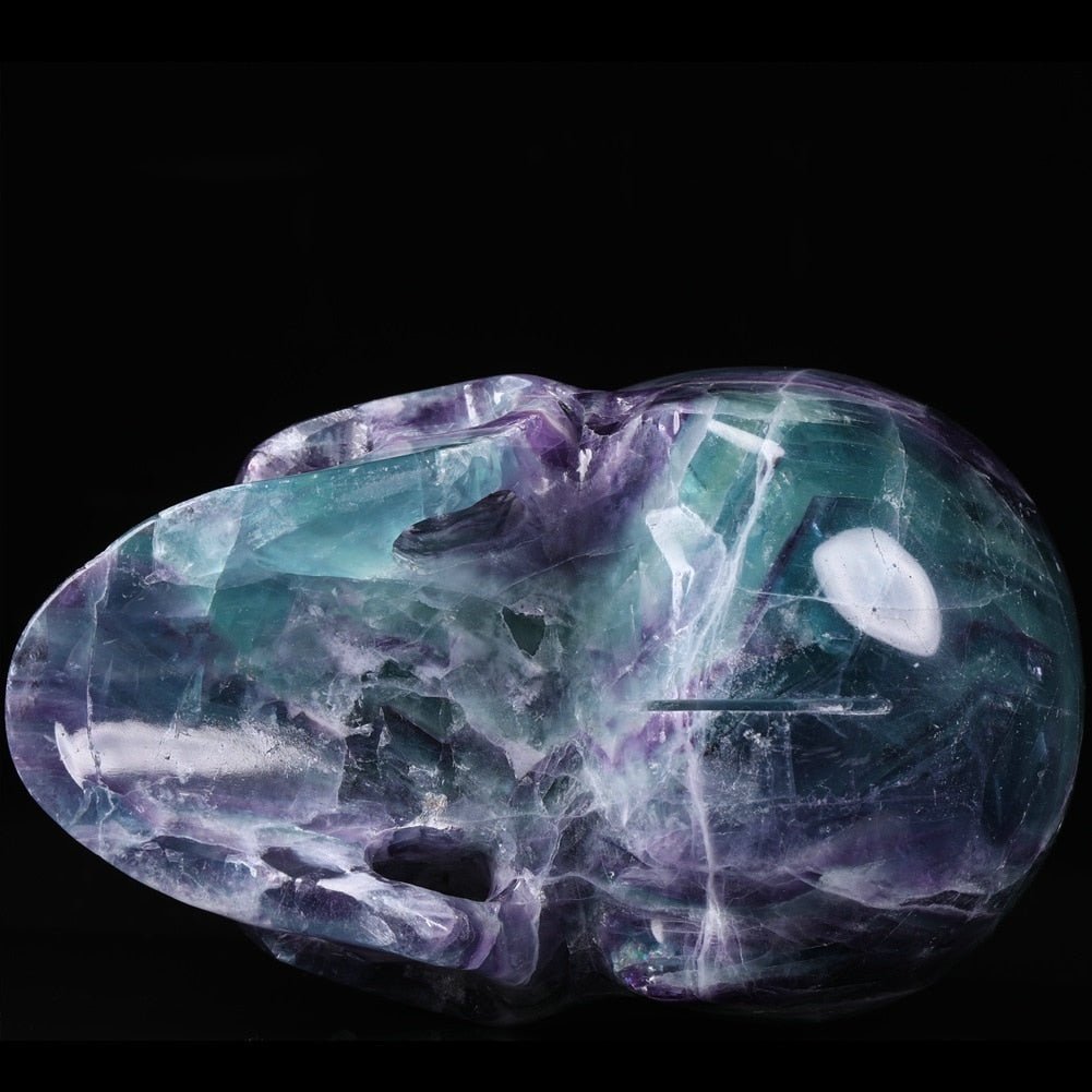 Natural Purple Fluorite 5 Inch Gemstone Skull showcasing vibrant colors and intricate details, symbolizing creativity and emotional healing.