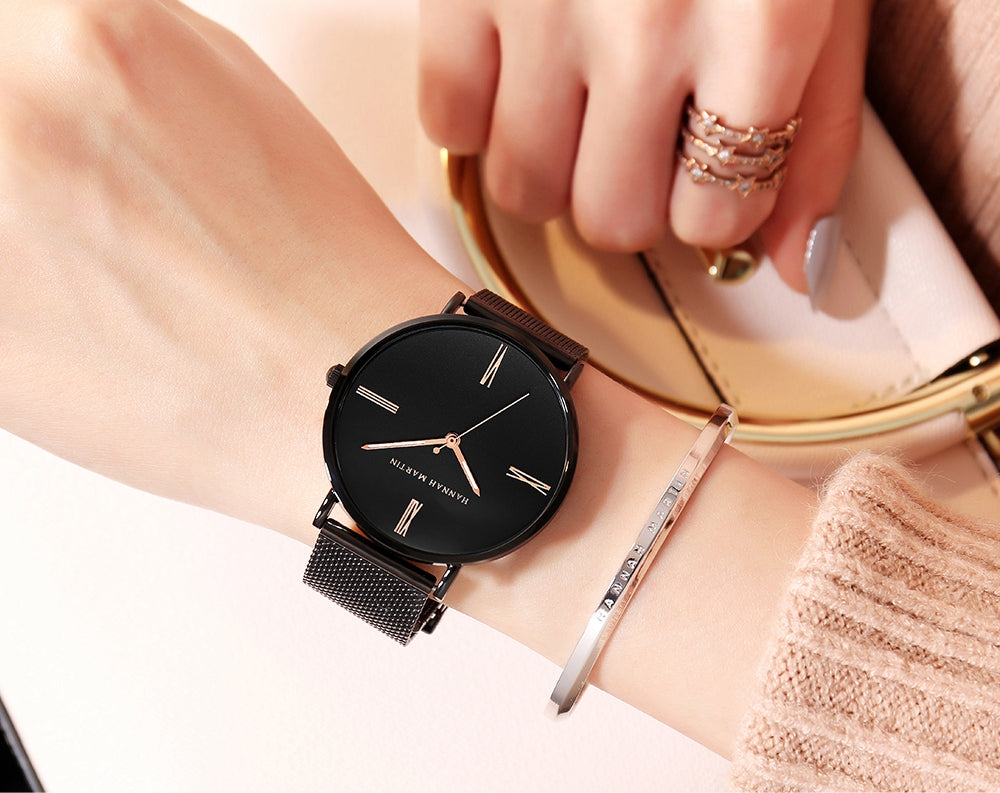 Stylish women's watch featuring a stainless steel mesh band and a round alloy case with a hardlex dial, showcasing a minimalist design.