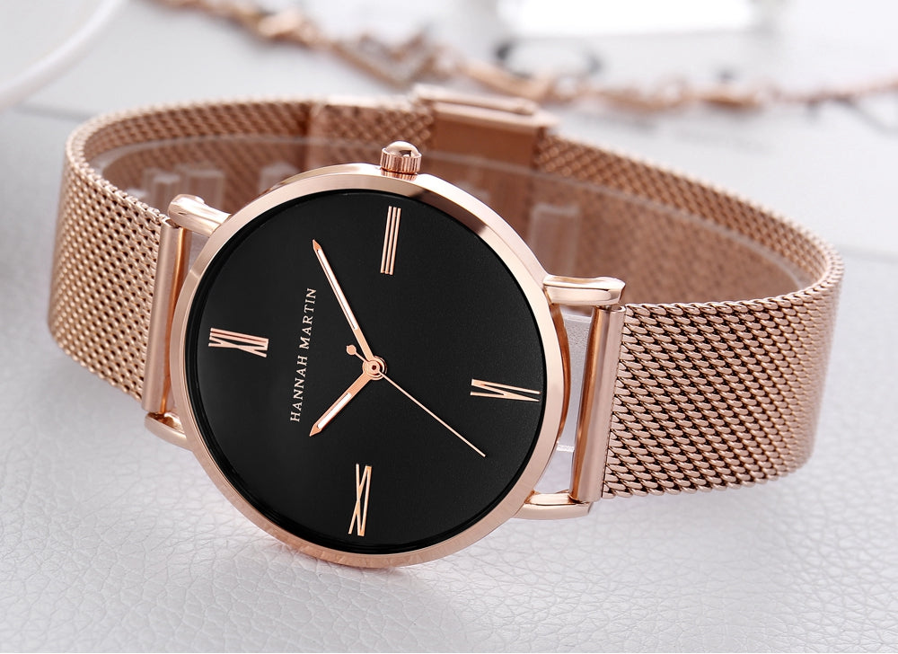 Stylish women's watch featuring a stainless steel mesh band and a round alloy case with a hardlex dial, showcasing a minimalist design.