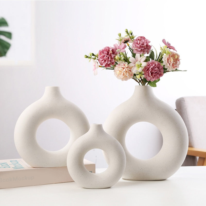 Nordic Ceramic Vase with circular hollow design, showcasing its elegant craftsmanship and smooth finish.