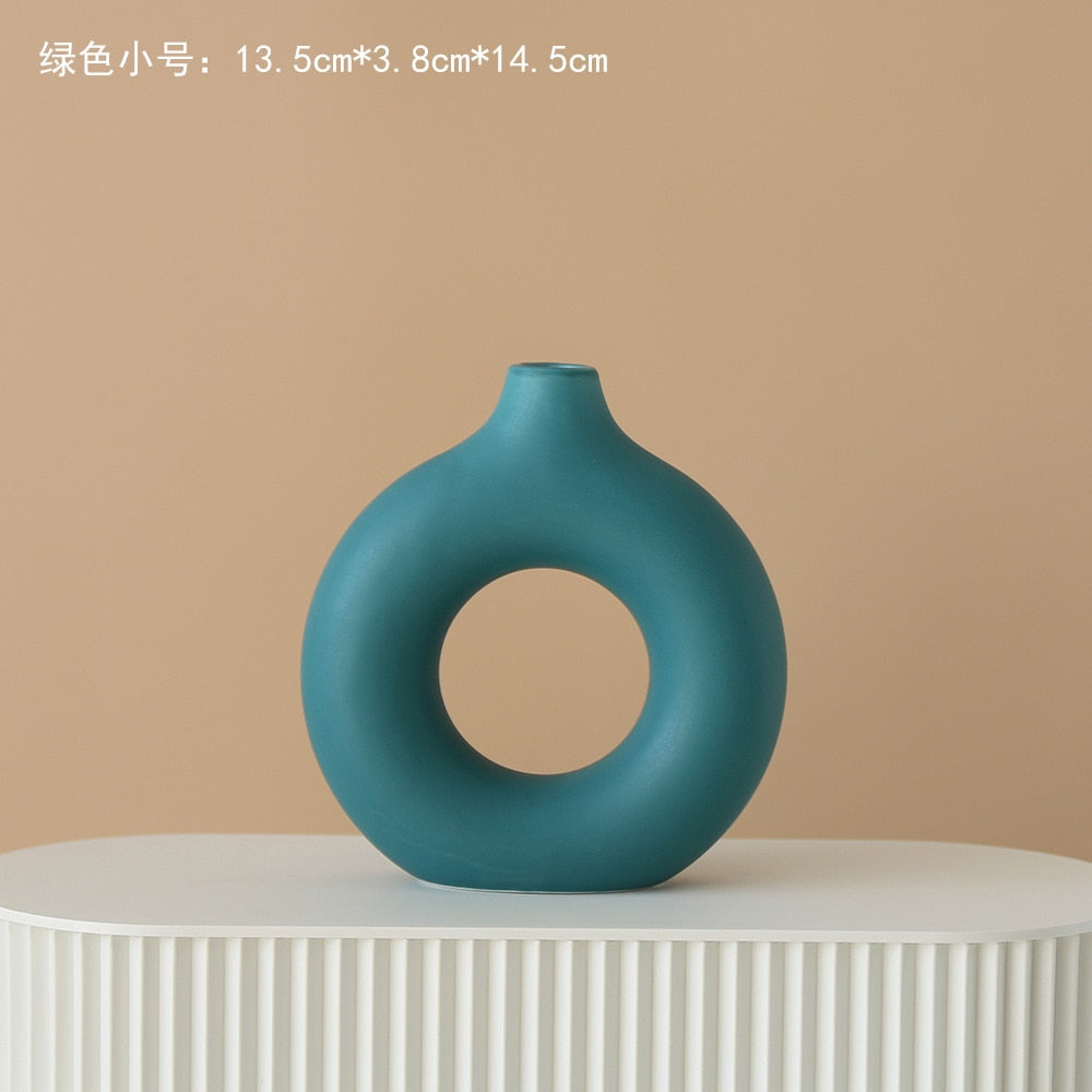 Nordic Ceramic Vase with circular hollow design, showcasing its elegant craftsmanship and smooth finish.