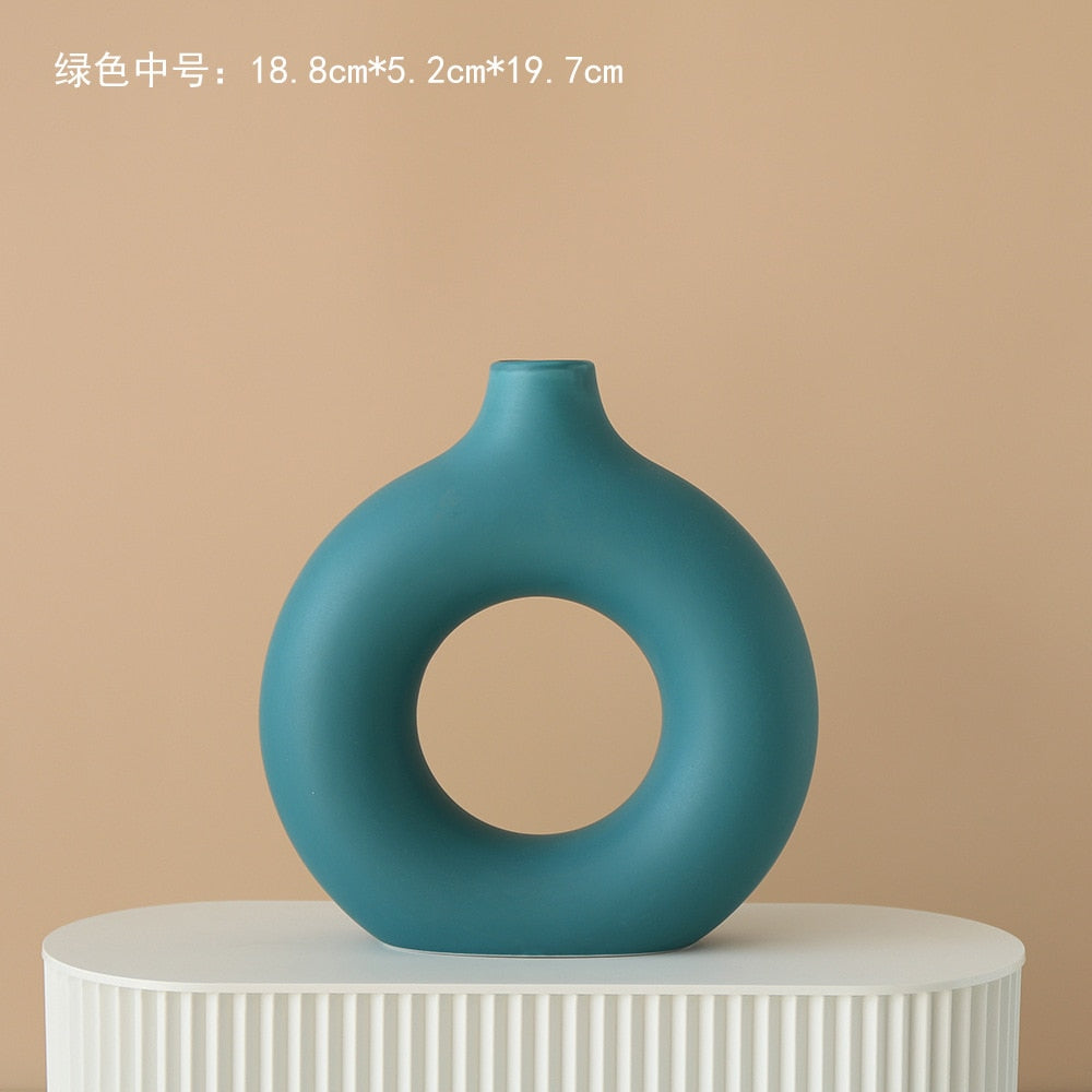 Nordic Ceramic Vase with circular hollow design, showcasing its elegant craftsmanship and smooth finish.