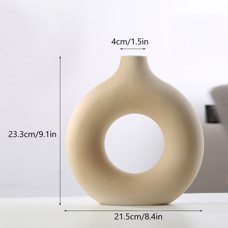 Nordic Ceramic Vase with circular hollow design, showcasing its elegant craftsmanship and smooth finish.