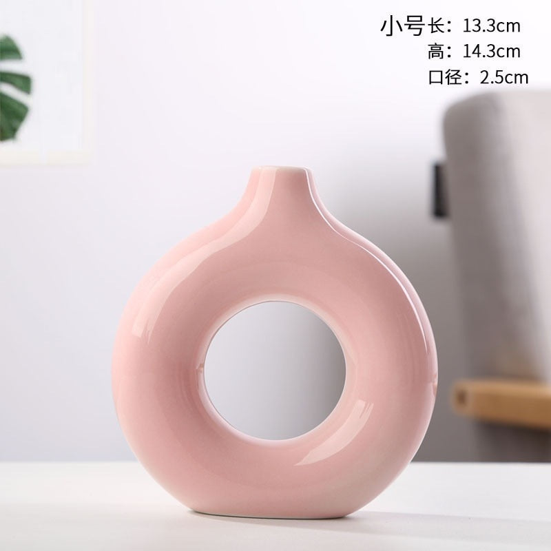 Nordic Ceramic Vase with circular hollow design, showcasing its elegant craftsmanship and smooth finish.