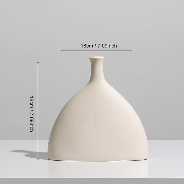 Nordic Ceramic Vase with circular hollow design, showcasing its elegant craftsmanship and smooth finish.