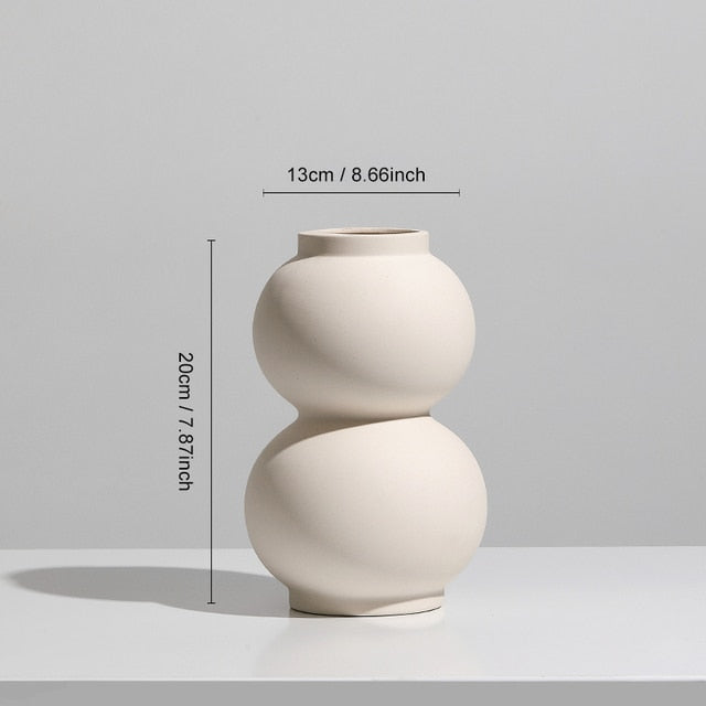 Nordic Ceramic Vase with circular hollow design, showcasing its elegant craftsmanship and smooth finish.