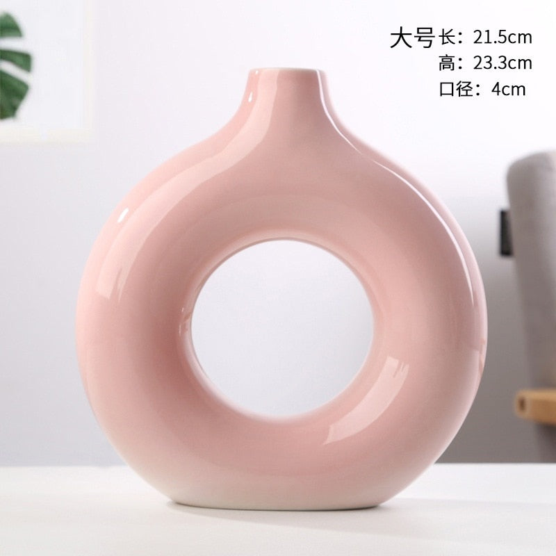 Nordic Ceramic Vase with circular hollow design, showcasing its elegant craftsmanship and smooth finish.