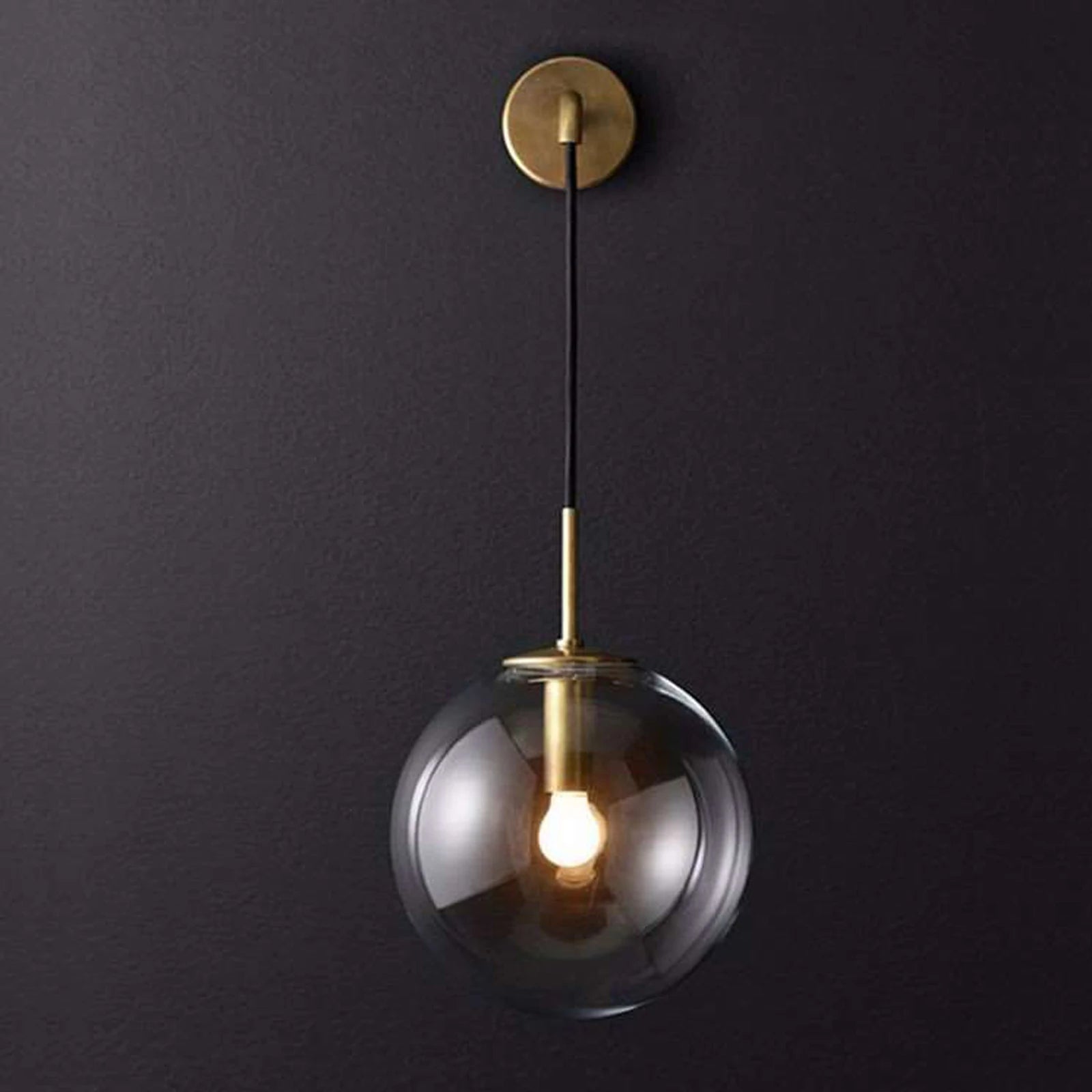 Nordic Glass Ball Wall Light featuring a black and gold finish with a clear glass globe shade, ideal for modern interiors.