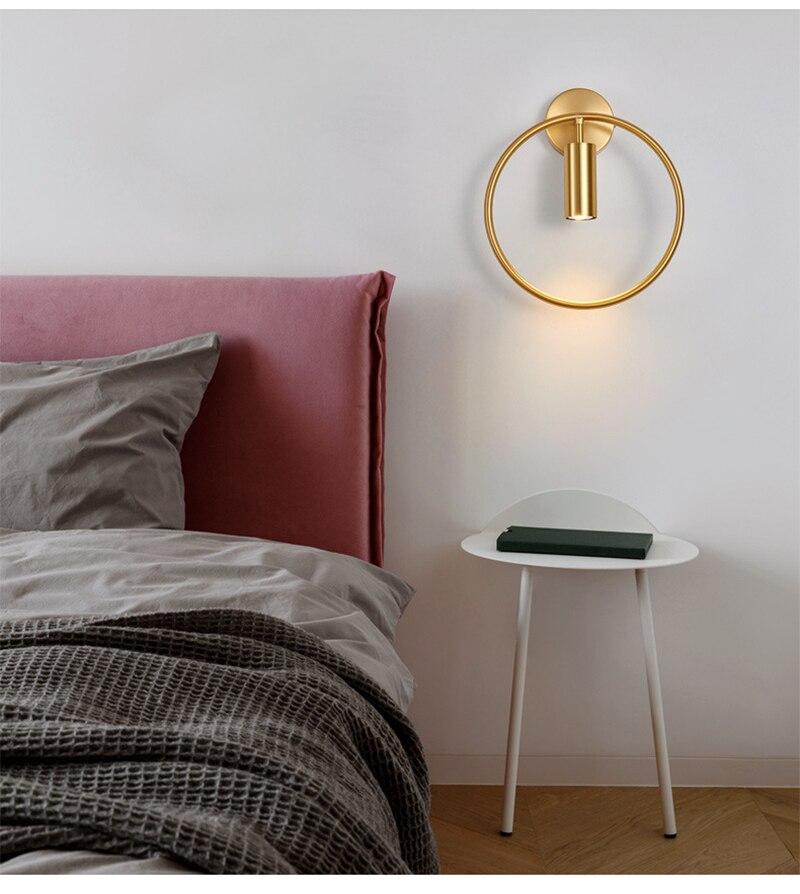 Nordic Minimalism GU10 LED wall lamp in black and gold, showcasing its sleek design and round shade, perfect for indoor lighting.