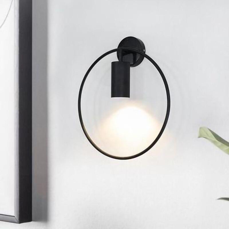 Nordic Minimalism GU10 LED wall lamp in black and gold, showcasing its sleek design and round shade, perfect for indoor lighting.