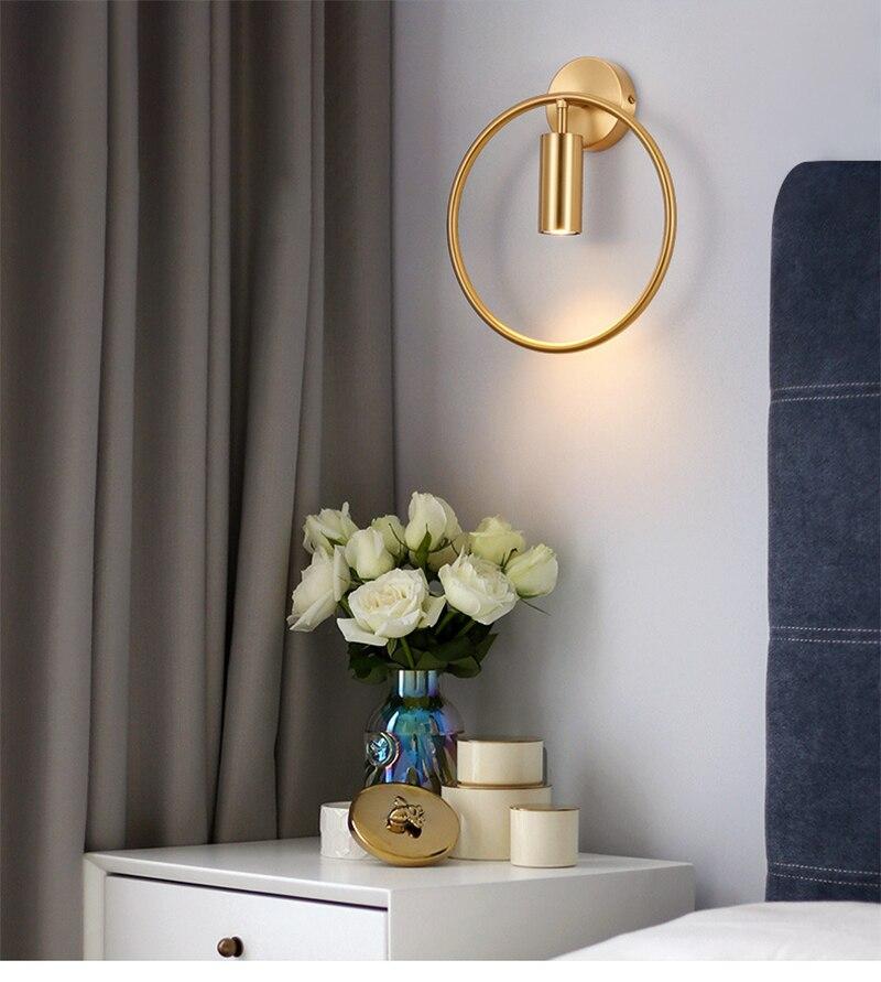 Nordic Minimalism GU10 LED wall lamp in black and gold, showcasing its sleek design and round shade, perfect for indoor lighting.