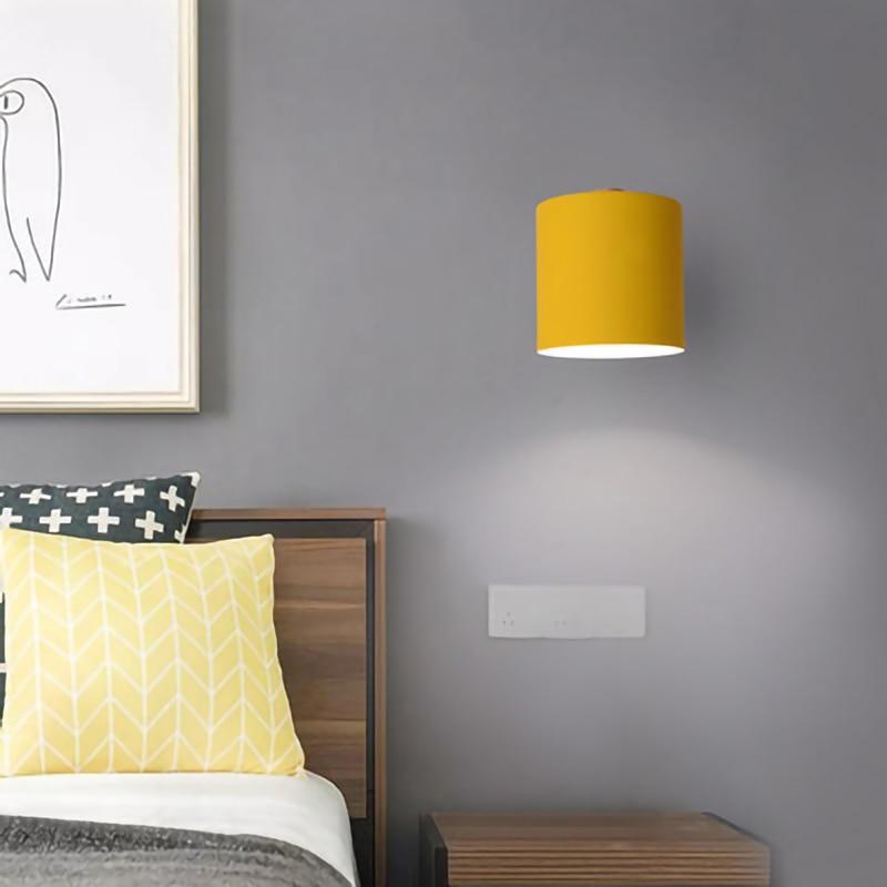 Nordic modern E27 LED wall lamp in various colors, showcasing its adjustable design and modern aesthetic.