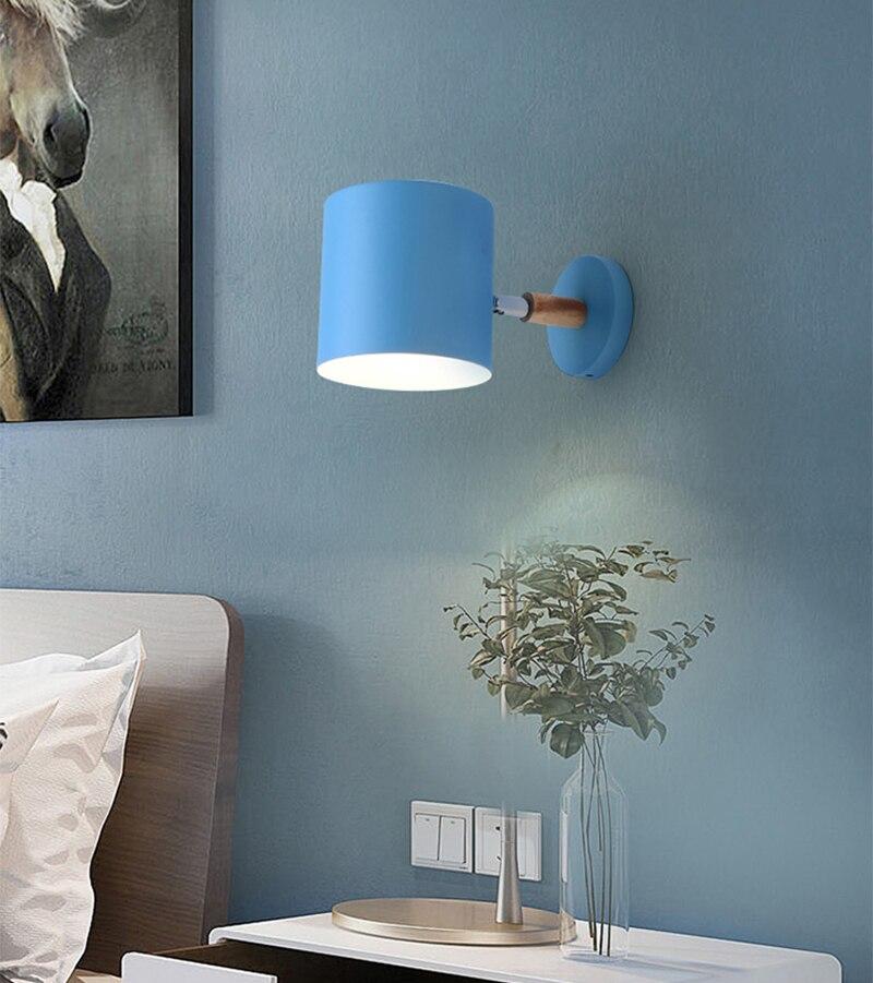 Nordic modern E27 LED wall lamp in various colors, showcasing its adjustable design and modern aesthetic.