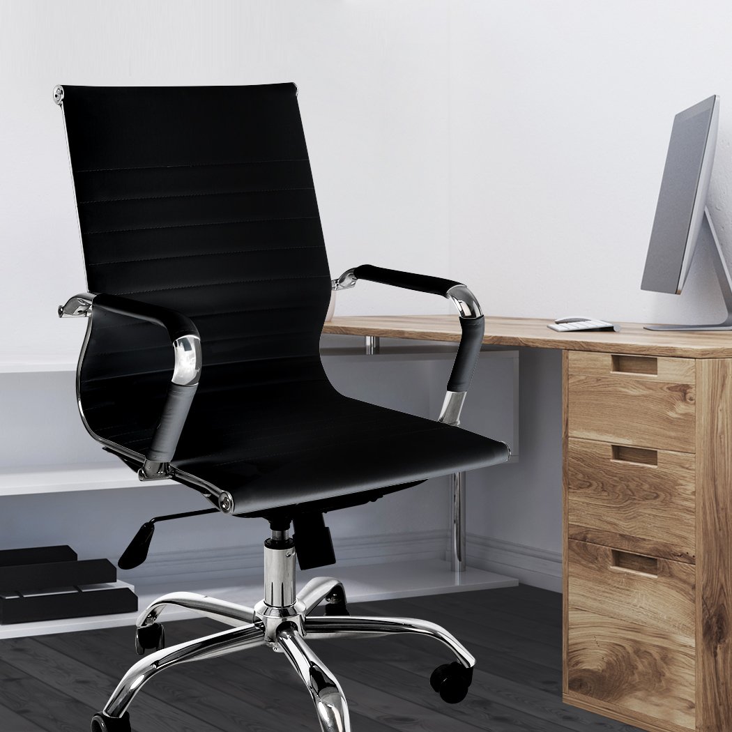 Stylish black PU leather office chair with chrome base and padded armrests, designed for comfort and mobility.