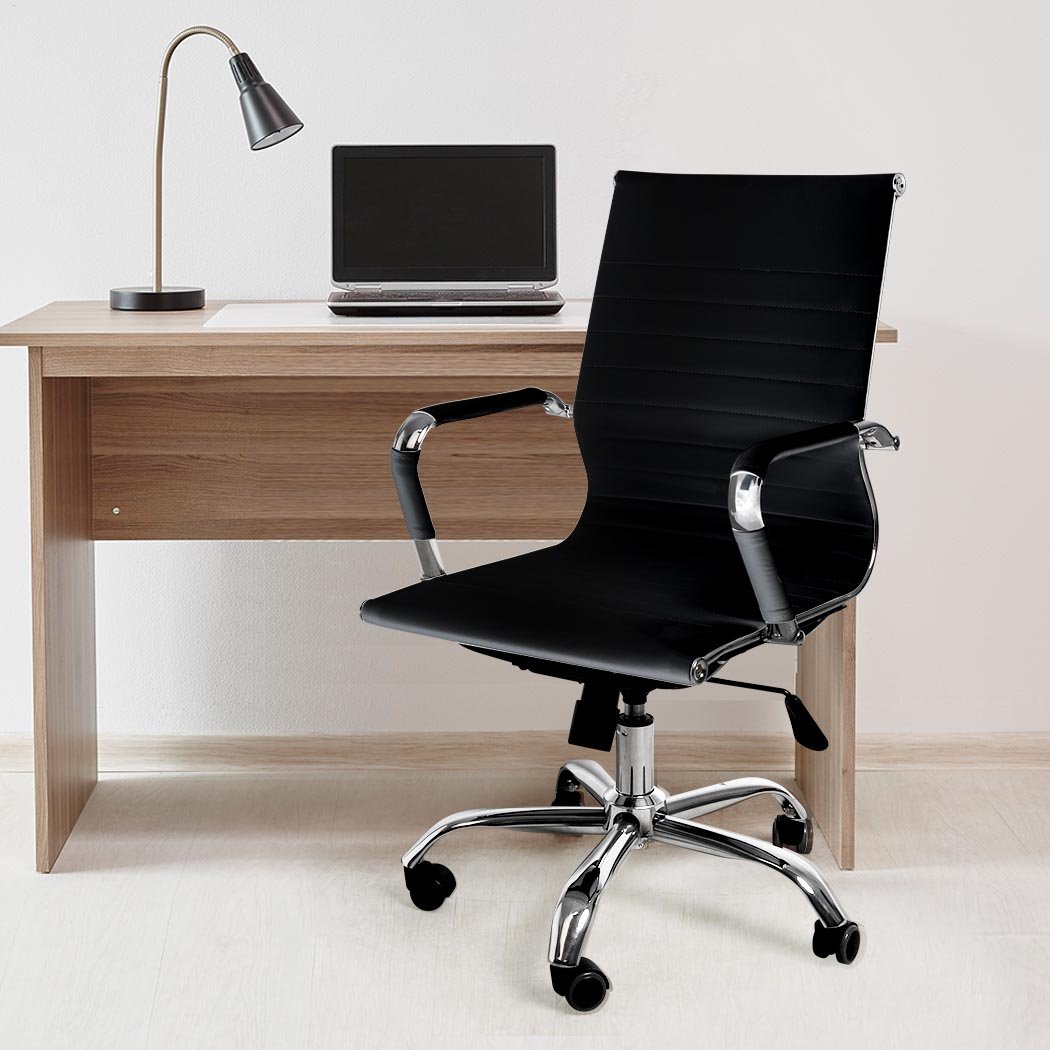 Stylish black PU leather office chair with chrome base and padded armrests, designed for comfort and mobility.