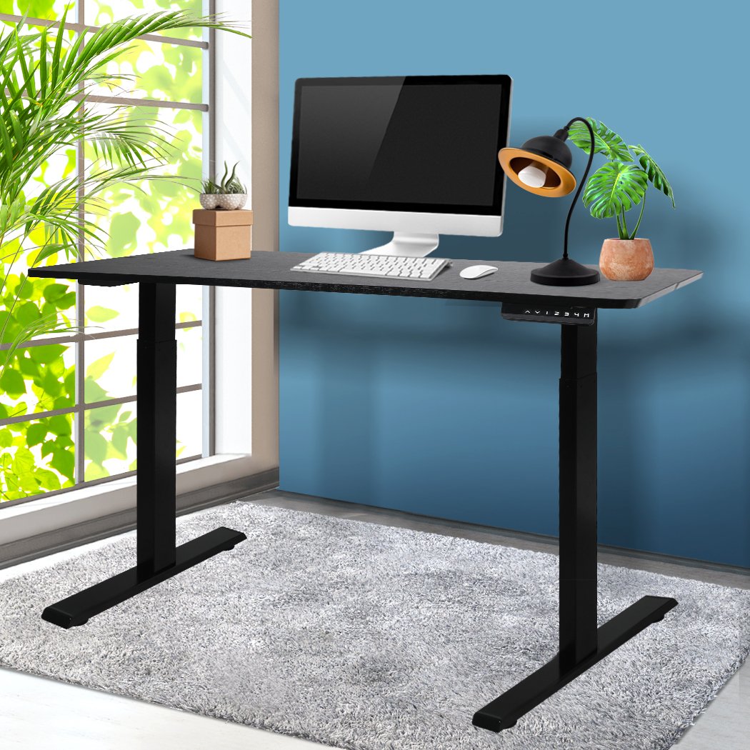 A sleek black motorised electric desk with height adjustment features, showcasing a modern design suitable for any office space.