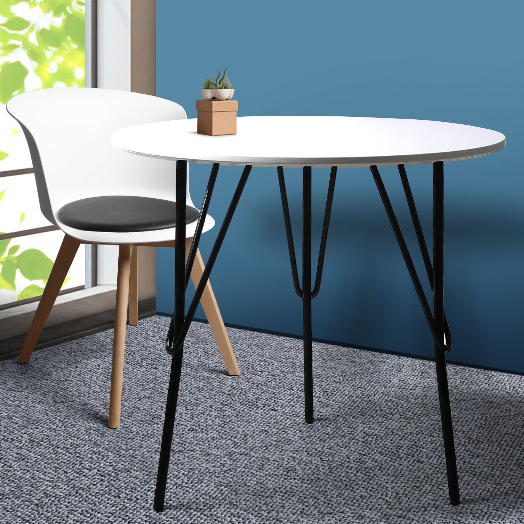 Modern round office meeting table with white MDF top and sturdy steel legs, perfect for home or office use.