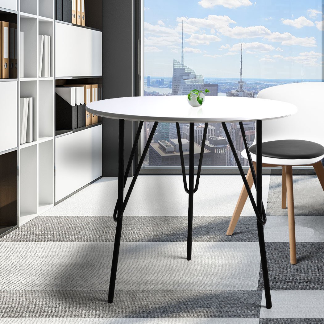 Modern round office meeting table with white MDF top and sturdy steel legs, perfect for home or office use.