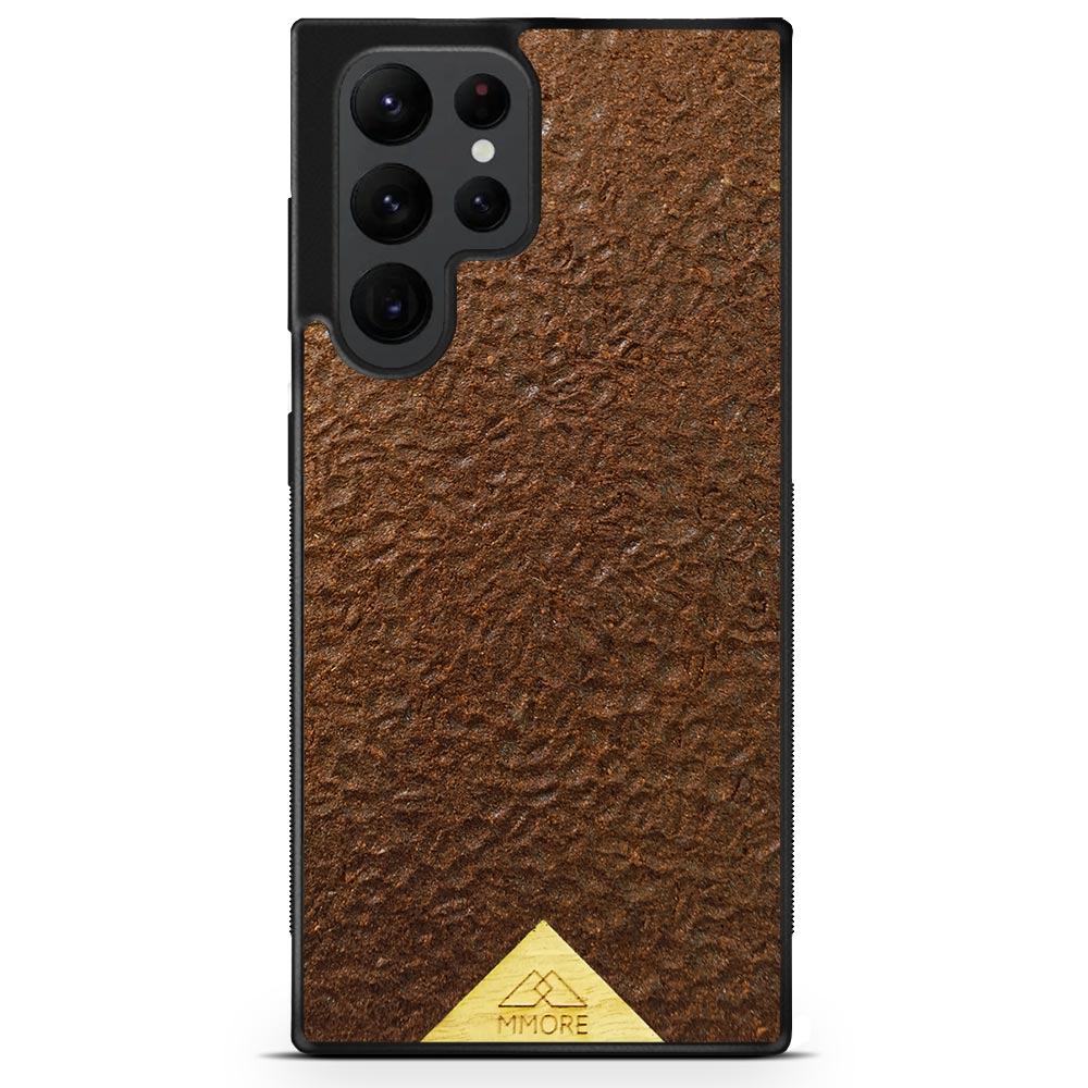 Organic Coffee Phone Case featuring a unique texture and aroma, held by a woman, showcasing its eco-friendly design.