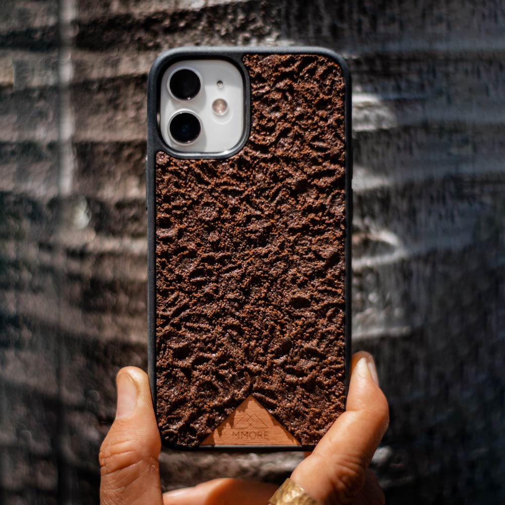 Organic Coffee Phone Case featuring a unique texture and aroma, held by a woman, showcasing its eco-friendly design.