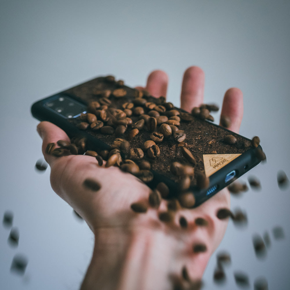 Organic Coffee Phone Case featuring a unique texture and aroma, held by a woman, showcasing its eco-friendly design.