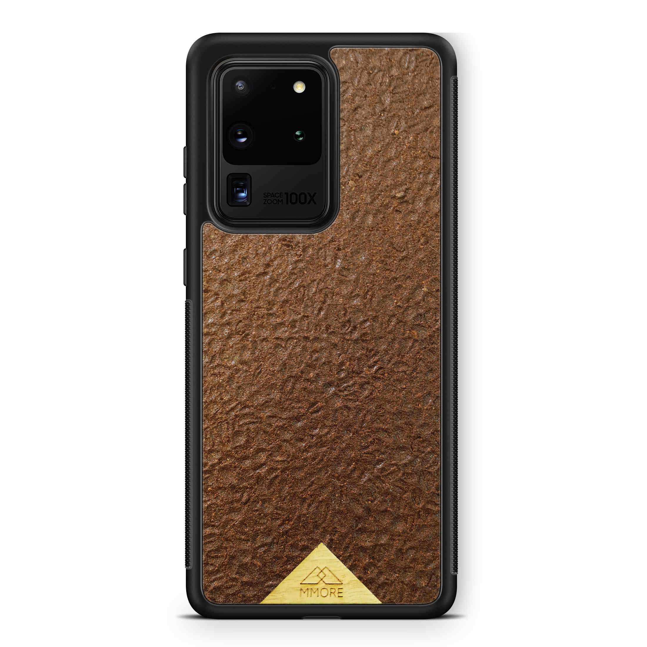 Organic Coffee Phone Case featuring a unique texture and aroma, held by a woman, showcasing its eco-friendly design.