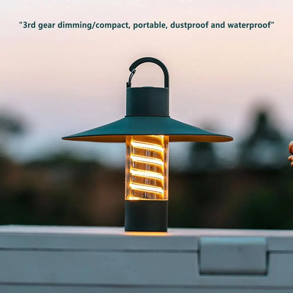 USB rechargeable outdoor camping light with detachable lampshade and tripod, designed for versatile illumination.