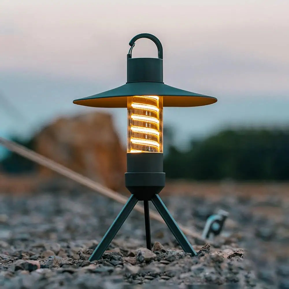 USB rechargeable outdoor camping light with detachable lampshade and tripod, designed for versatile illumination.