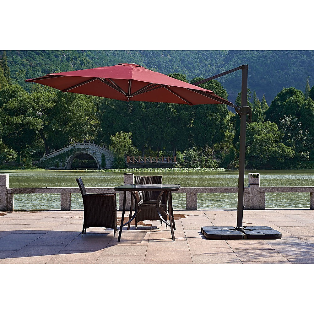 Outdoor Patio 4-Piece Cantilever Offset 3M Umbrella Base Stand Weight in black, showcasing its heavy-duty design and easy-fill spout.