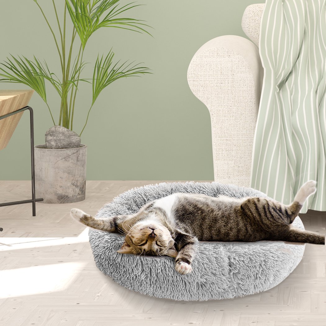 PaWz Pet Bed in light grey, donut-shaped design with plush surface and non-slip bottom, perfect for dogs and cats.