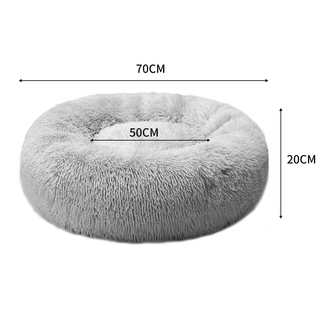 PaWz Pet Bed in light grey, donut-shaped design with plush surface and non-slip bottom, ideal for dogs and cats.