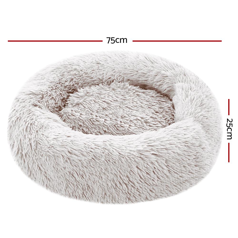 Medium-sized white pet bed with brown accents, designed for dogs and cats, featuring a soft surface and non-slip base.