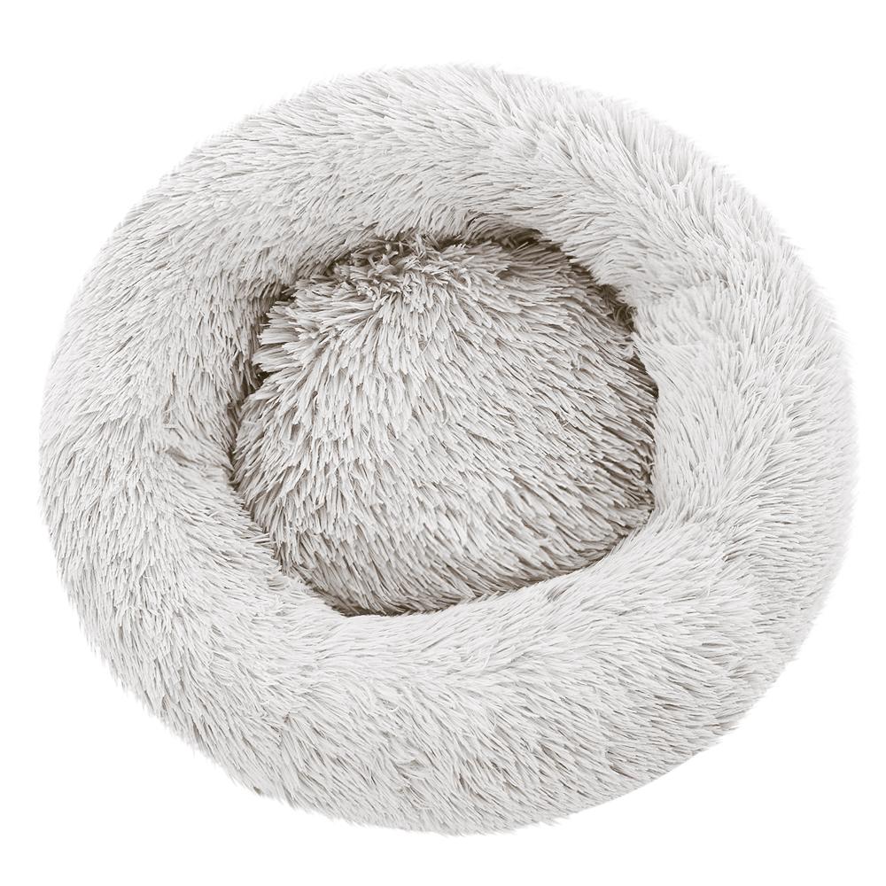 Medium-sized white pet bed with brown accents, designed for dogs and cats, featuring a soft surface and non-slip base.