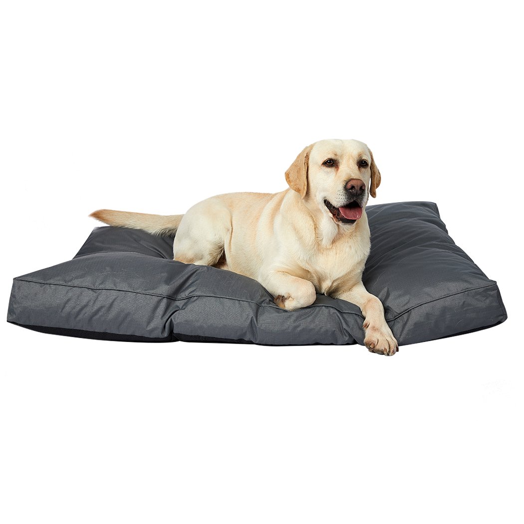 A cozy grey pet bed made of soft fleece and durable oxford fabric, designed for dogs and cats with a plush, overstuffed cushion for ultimate comfort.