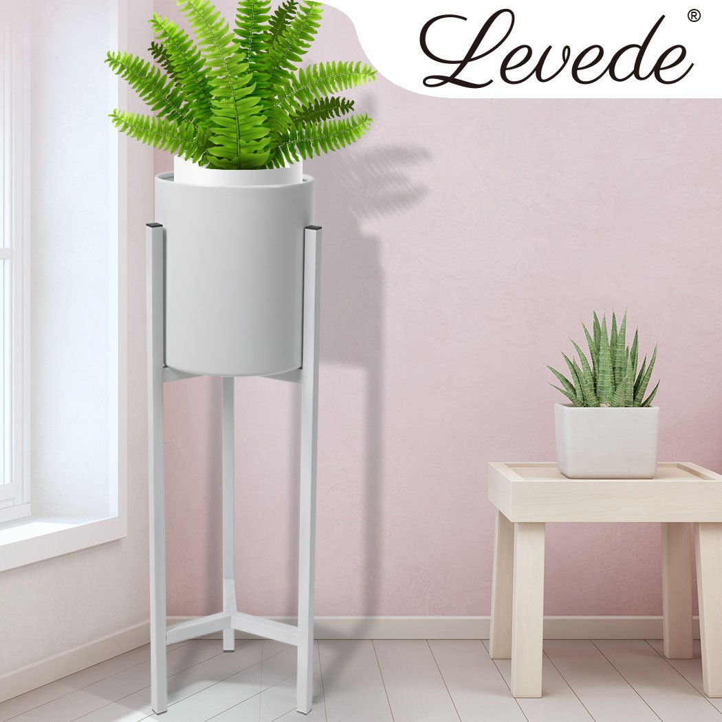 Elegant metal plant stand with a detachable pot, perfect for showcasing plants indoors and outdoors.