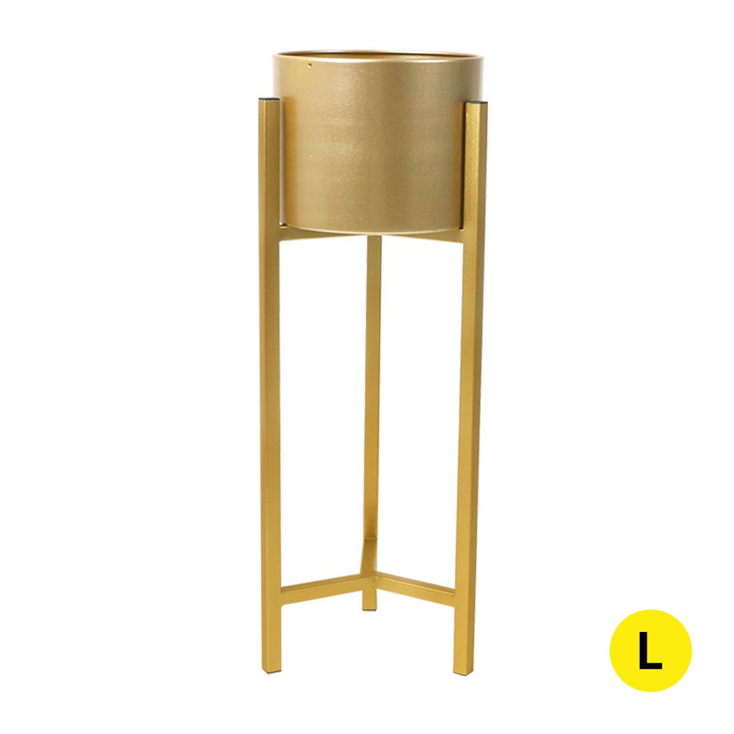 Elegant metal plant stand with a gold finish, showcasing a beautiful flower pot, perfect for home and garden decor.