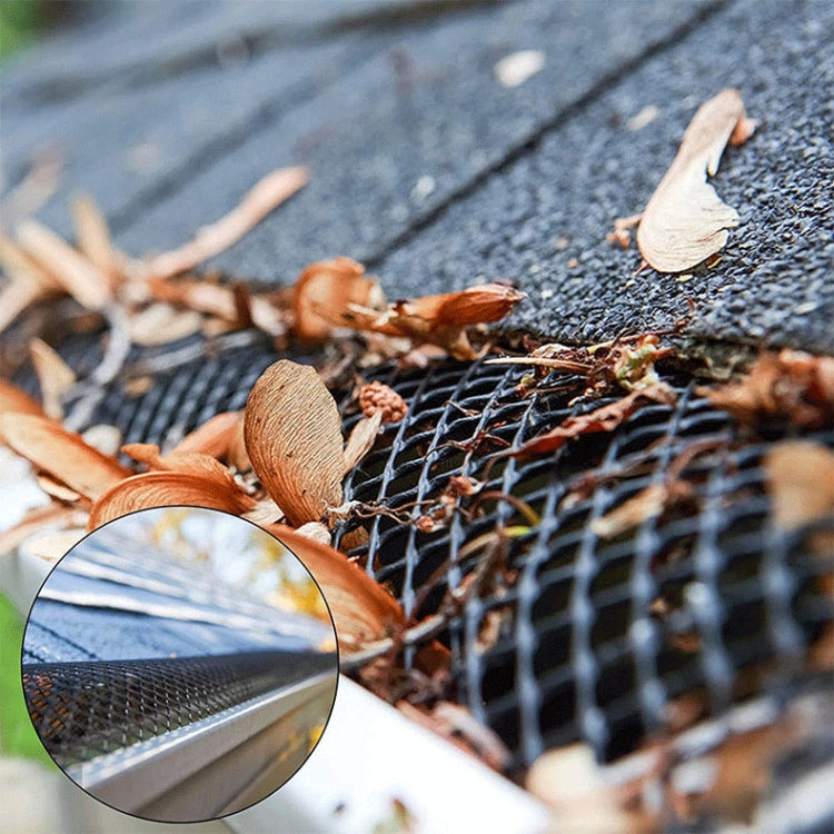 Plastic gutter guard designed to prevent leaves and debris from clogging downspouts, showcasing its mesh structure and adjustable features.