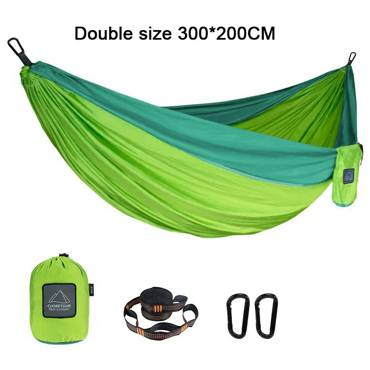 Portable Nylon Parachute Fabric Hammock in outdoor setting, showcasing its lightweight and comfortable design.