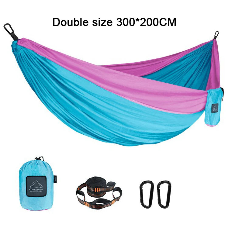 Portable Nylon Parachute Fabric Hammock in outdoor setting, showcasing its lightweight and comfortable design.